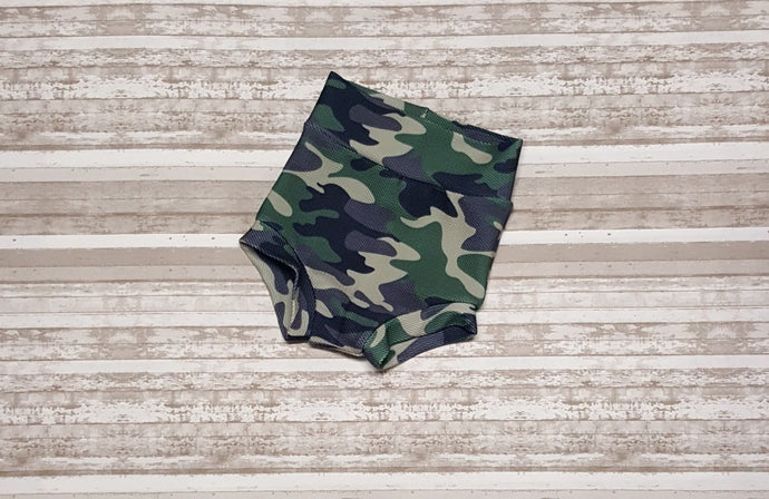 Camouflage colored diaper covers for infants and toddlers.